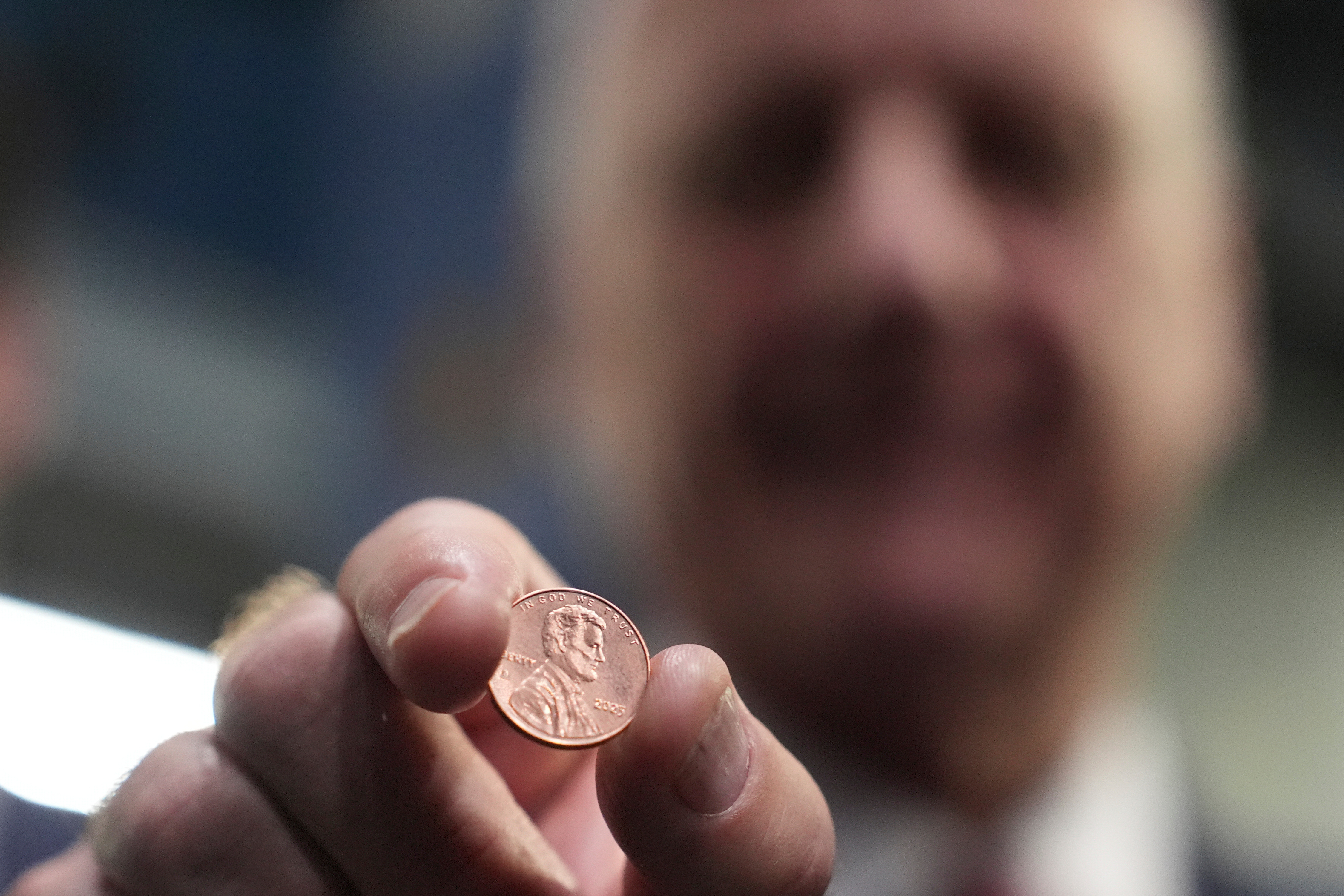 U.S. Treasurer Brandon Beach holds one of the last pennies pressed at the U.S. Mint, in Philadelphia, Nov. 12, 2025.