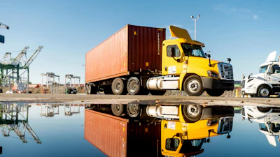 truck departs from a Port of Oakland shipping terminal on Nov. 10, 2021, in Oakland, Calif.