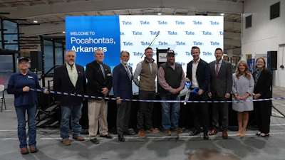 Ribbon-cutting ceremony for Tate's facility.