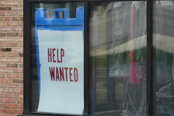 'Help Wanted' sign is displayed at a dry cleaner in Rolling Meadows, Ill., Thursday, May 15, 2025.