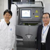 Naoki Takata of Nagoya University, lead researcher on the project (left), and Masaki Kato, senior author and division head of Aichi Center for Industry and Science Technology (right), with the center's laser 3D printer that creates stronger, heat-resistant aluminum alloys layer by layer.