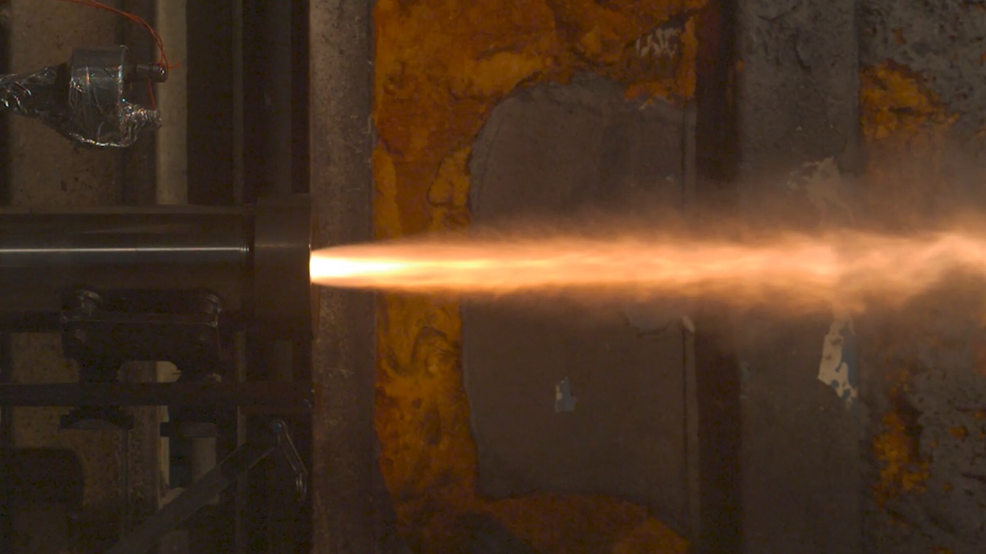 A static test fire of an additively manufactured pressure vessel for a solid rocket motor.