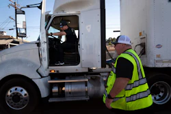A student driver gets on a truck as the instructor watches in Calif., Nov. 15, 2021.