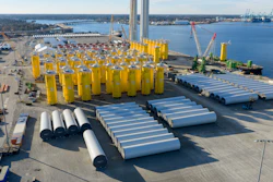 Wind turbine bases, generators and blades are positioned along with support ships at The Portsmouth Marine terminal at the staging area for Dominion Energy's wind turbine project Monday Dec. 22, 2025, in Portsmouth, Va.