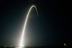 In this time-exposure photograph, a SpaceX Falcon 9 rocket with the 25th batch of approximately 60 satellites for SpaceX's Starlink broadband network lifts off from the Space Launch Complex 40 at the Cape Canaveral Space Force Station in Cape Canaveral, Fla., late Wednesday, April 28, 2021.