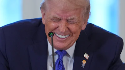 President Donald Trump laughs during a meeting with oil executives in the East Room of the White House, Jan. 9, 2026, Washington.