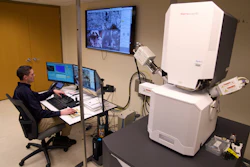 Materials Engineer Mike Meadows looks at training samples on a microelectronic microscope in the Materials Laboratory of the National Transportation Safety Board (NTSB), Tuesday, Jan. 20, 2026, in Washington.