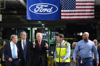 President Donald Trump speaks to, from left Bill Ford, Executive Chairman of Ford, Treasury Secretary Scott Bessent, Jim Farley, CEO of Ford, and Corey Williams, Ford River Rouge Plant Manager, during a tour of the Ford River Rogue complex, Tuesday, Jan. 13, 2026, in Dearborn, Mich.