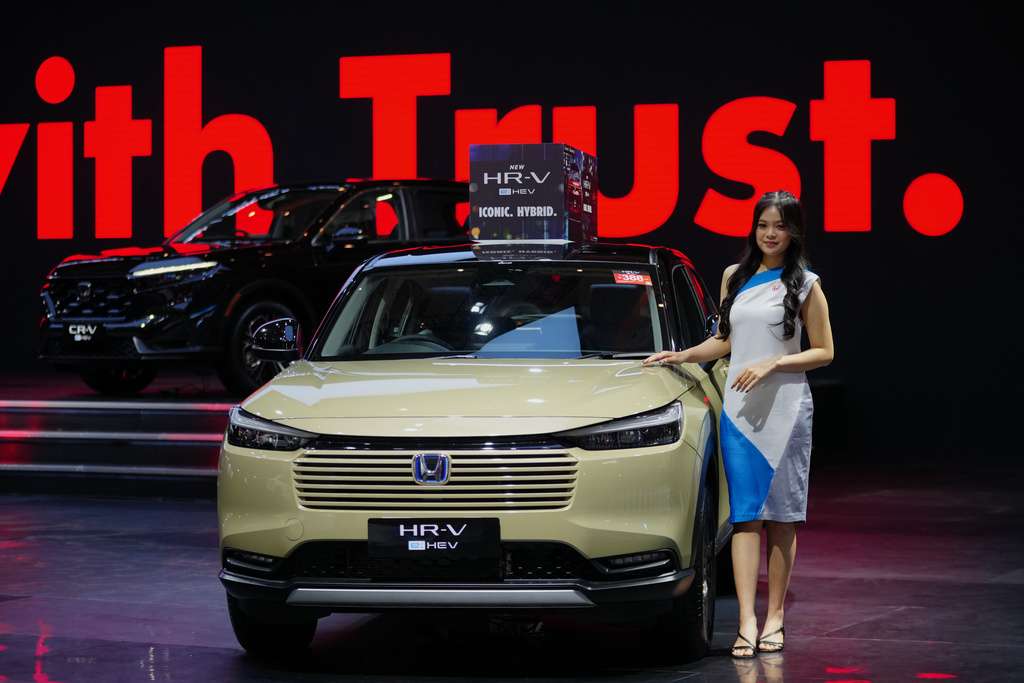 A model poses near a Honda HR-V car during the Indonesian International Motor Show in Jakarta, Indonesia, Thursday, Feb. 5, 2026.
