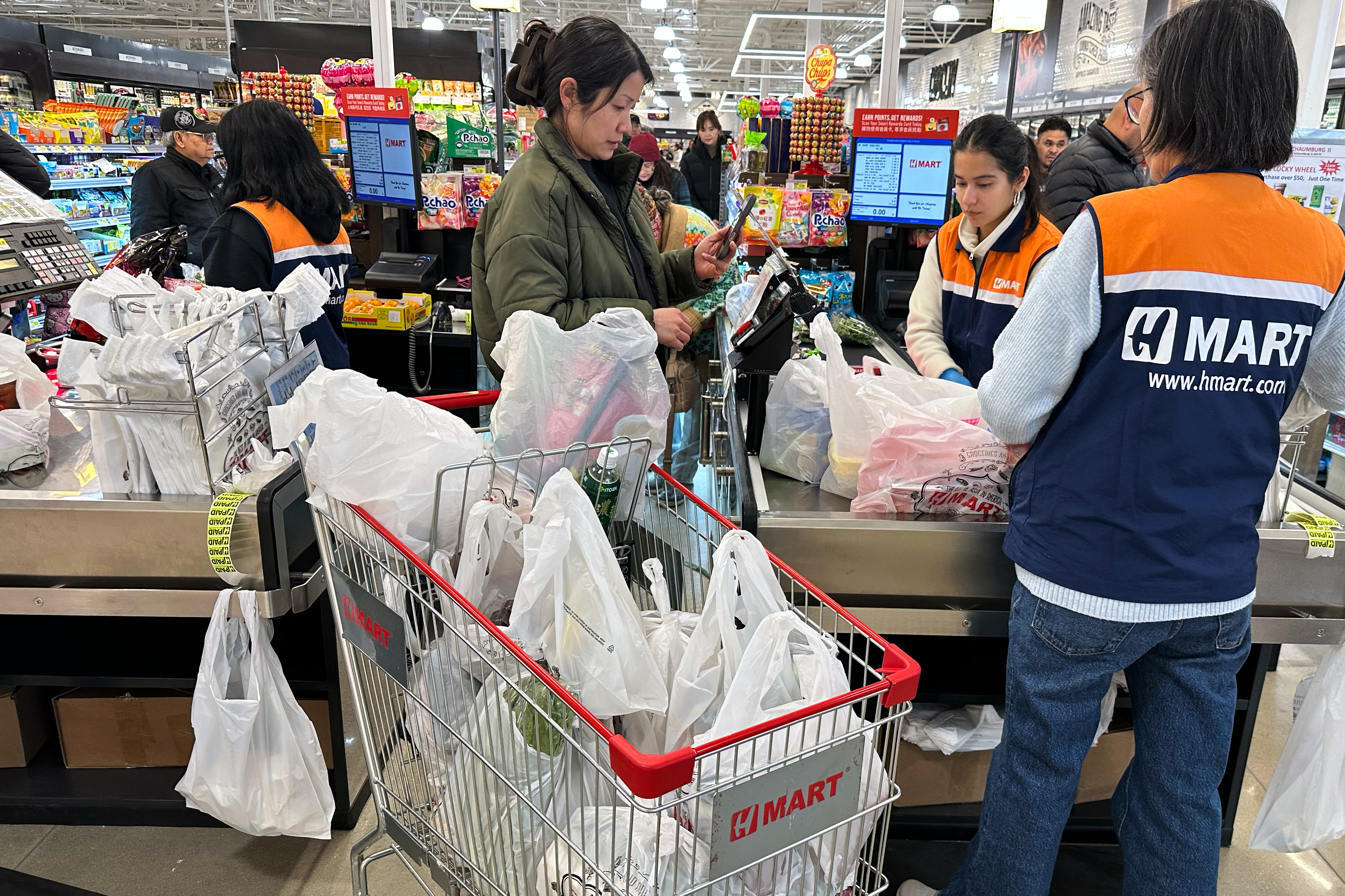 A shopper checks out in a grocery store in Schaumburg, Ill., Feb. 9, 2026.