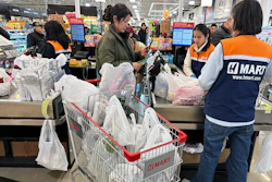 A shopper checks out in a grocery store in Schaumburg, Ill., Feb. 9, 2026.