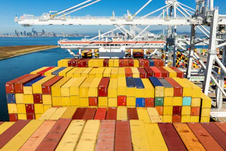 Cargo containers line a ship at the Port of Oakland, Oakland, Calif., Aug. 6, 2025.