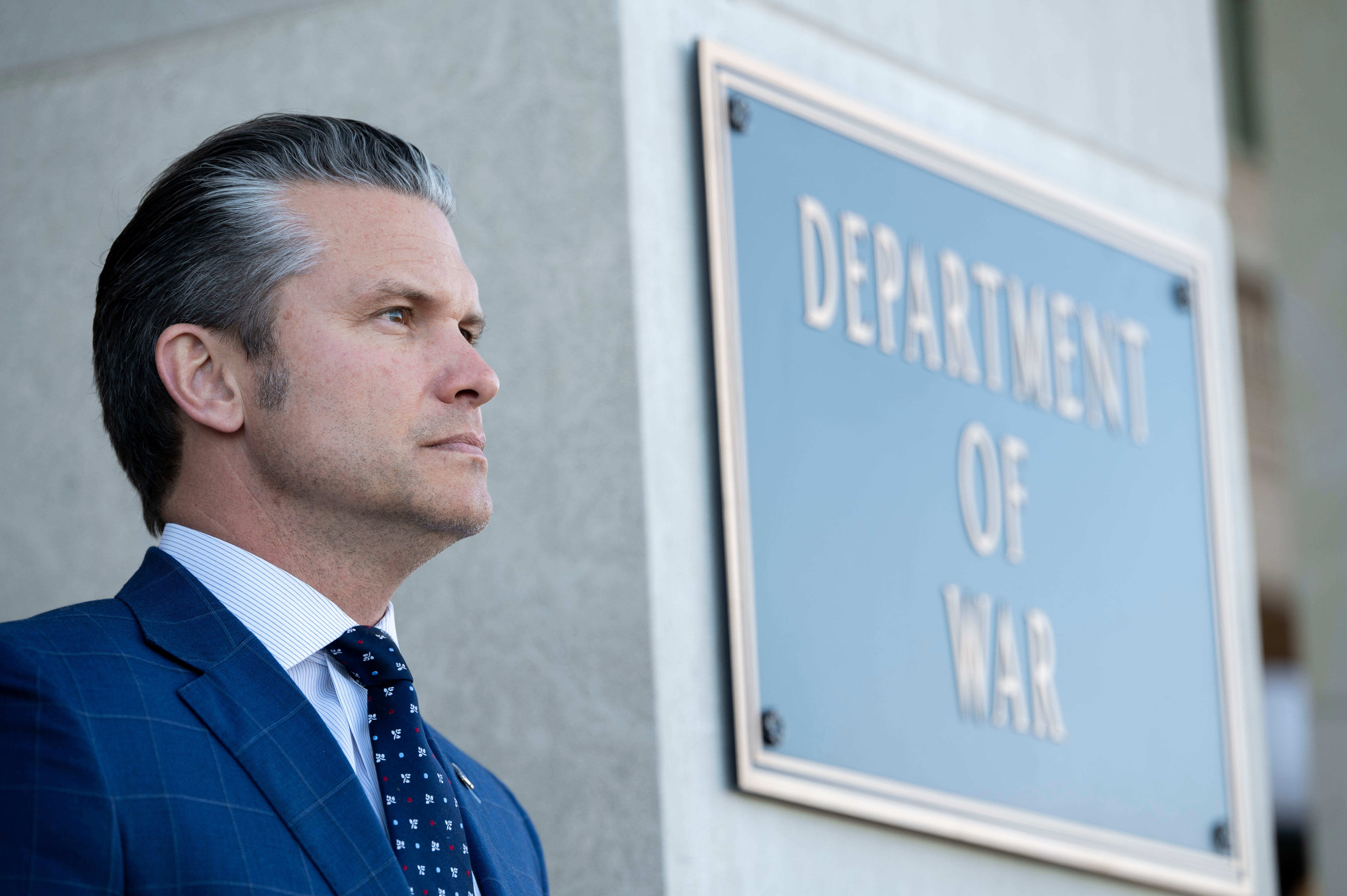 Defense Secretary Pete Hegseth stands outside the Pentagon during a welcome ceremony for the Japanese defense minister at the Pentagon in Washington, Jan. 15, 2026.