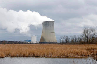 Plumes of steam drift from the cooling tower of FirstEnergy Corp.'s Davis-Besse Nuclear Power Station in Oak Harbor, Ohio, April 4, 2017.