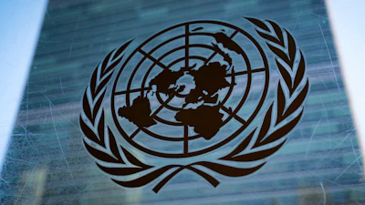 The symbol of the United Nations is displayed outside the Secretariat Building, Feb. 28, 2022, at United Nations Headquarters.