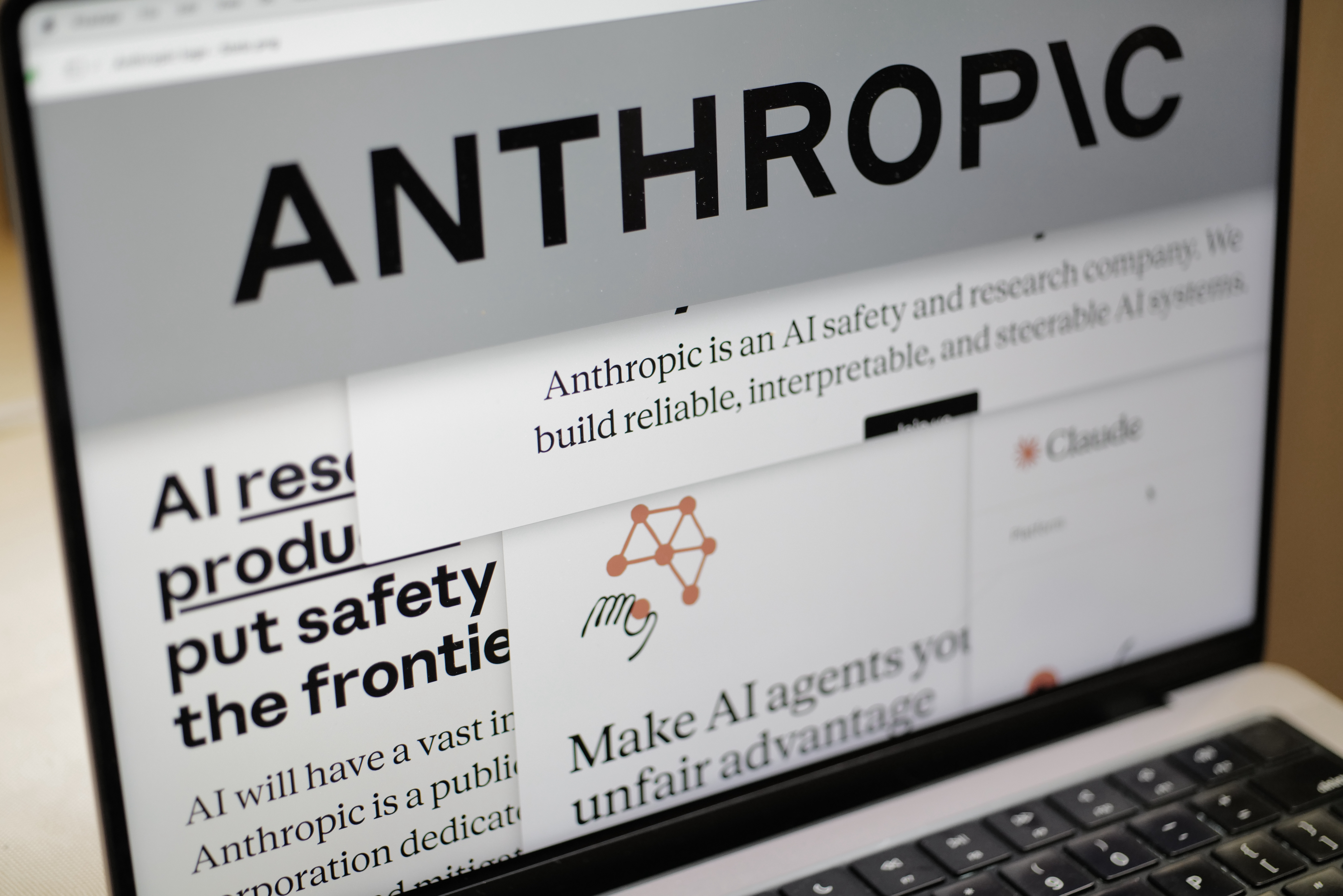Pages from the Anthropic website and the company's logo are displayed on a computer screen in New York, Feb. 26, 2026.
