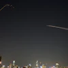 The Israeli air defense system fires to intercept missiles during an Iranian attack over Tel Aviv, March 3, 2026.