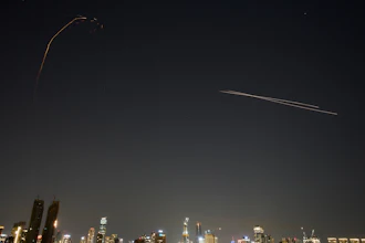 The Israeli air defense system fires to intercept missiles during an Iranian attack over Tel Aviv, March 3, 2026.