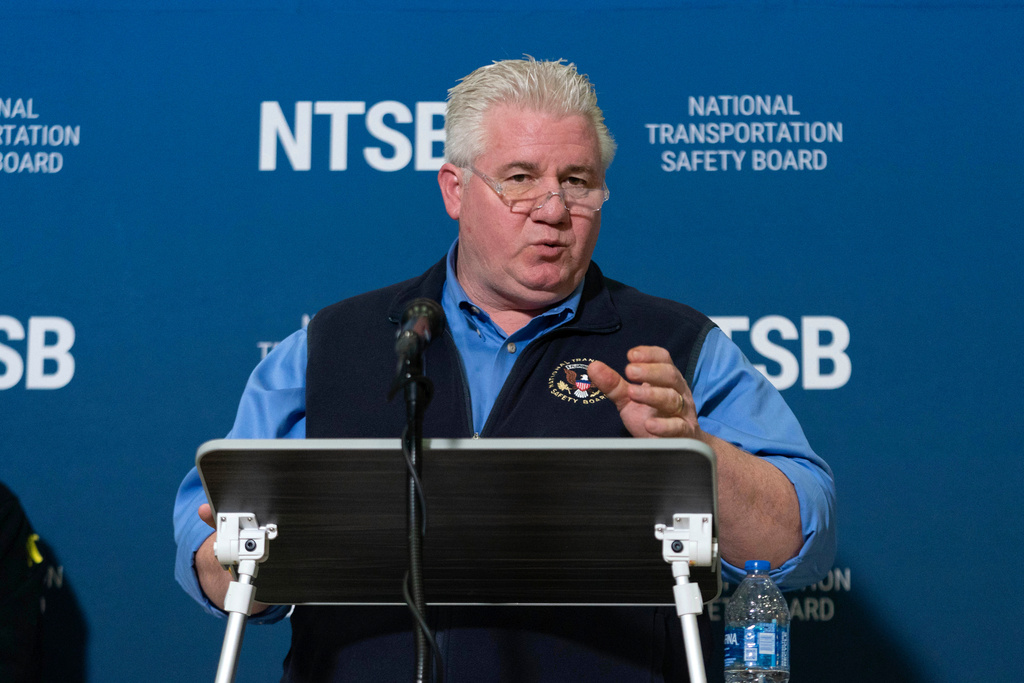 National Transportation Safety Board member Todd Inman speaks with reporters at Ronald Reagan Washington National Airport, Feb. 1, 2025, in Arlington, Va.