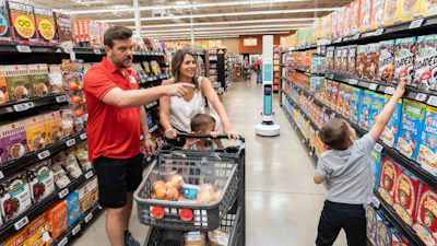 Family In Grocery Store With Tally Robot