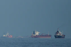 Oil tankers and cargo ships line up in the Strait of Hormuz as seen from Khor Fakkan, United Arab Emirates, March 11, 2026.
