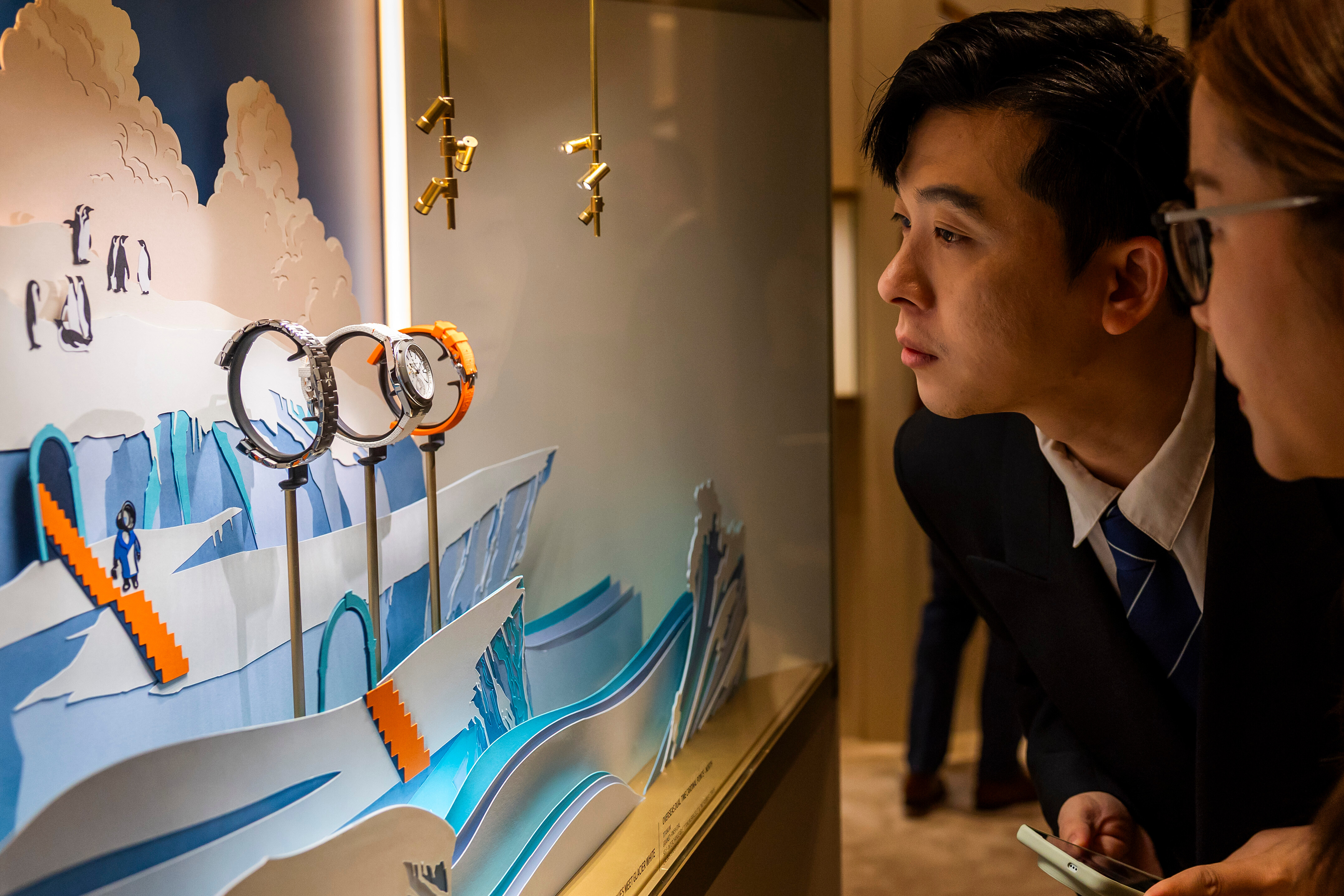 Visitors look at watches at the Swiss watch manufacturer Vacheron Constantin stand, during the opening day of the 'Watches and Wonders Geneva' luxury watch fair, in Geneva, Switzerland, Tuesday, April 14, 2026.