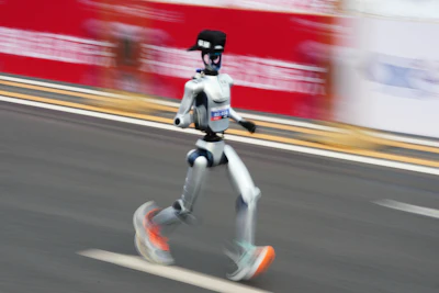 A robot starts off for the Beijing E-Town Half Marathon and Humanoid Half Marathon on the outskirts of Beijing on Sunday, April 19, 2026.