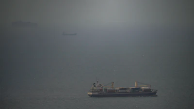 A cargo ship sails in the Persian Gulf toward the Strait of Hormuz, April 22, 2026.