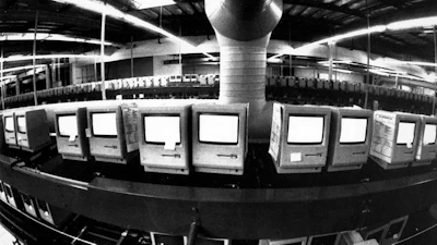 In this March 28, 1984, file photo, thousands of Apple Macintosh computers sit on double decked manufacturing lines.