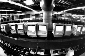 In this March 28, 1984, file photo, thousands of Apple Macintosh computers sit on double decked manufacturing lines.