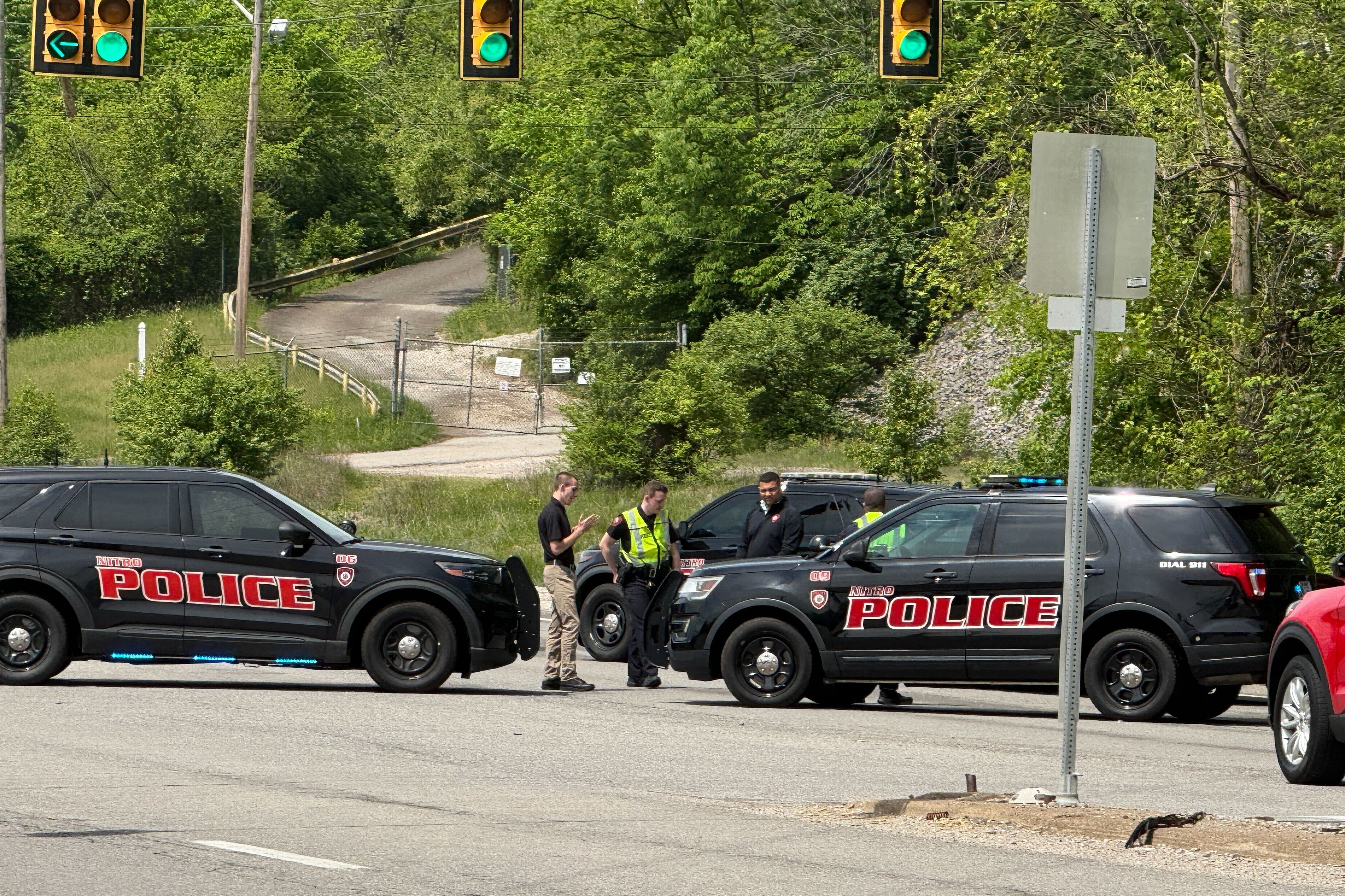 Police block a road near a chemical plant where a leak occurred Wednesday, April 22, 2026, in Institute, W.Va.