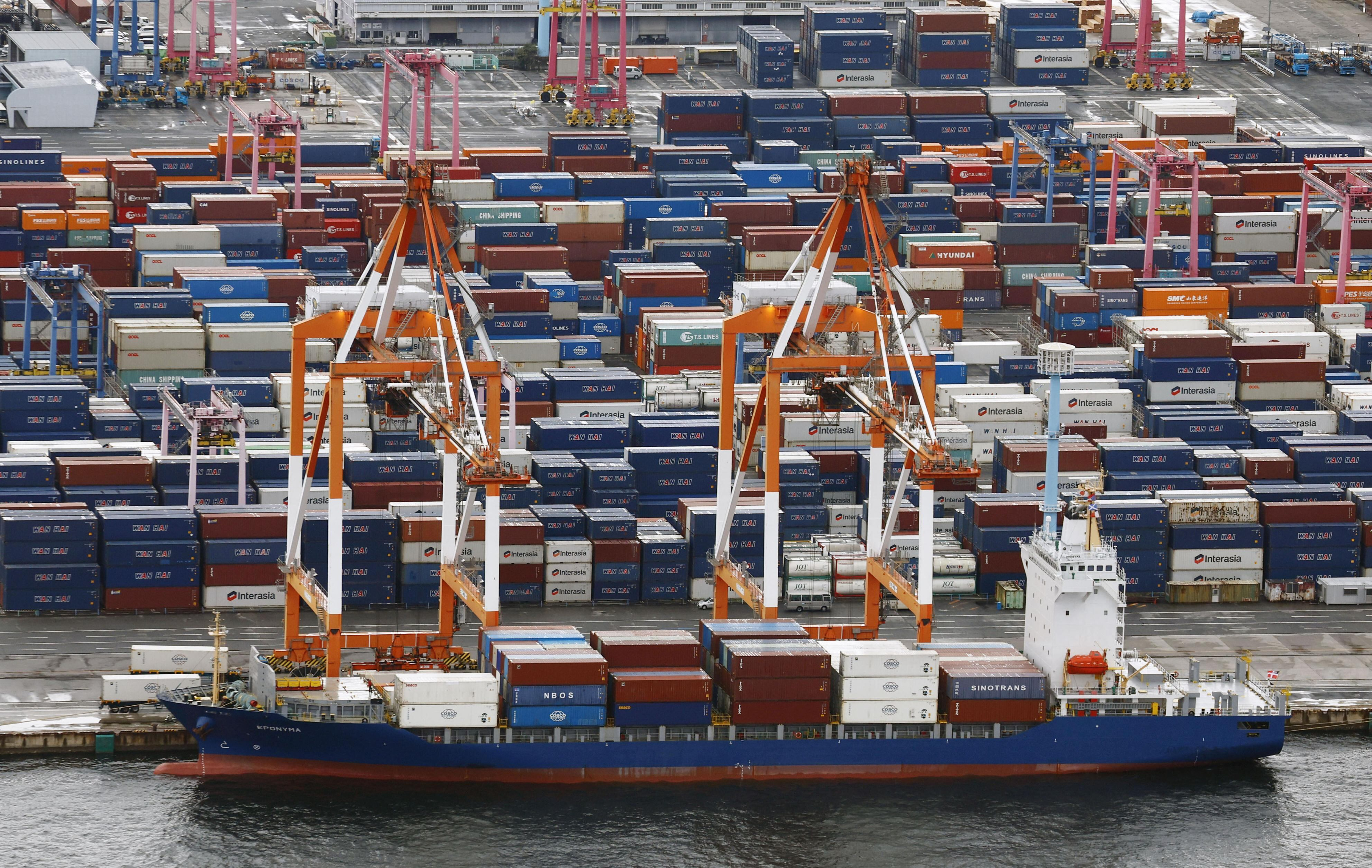 Containers are stacked at a port in Yokohama, near Tokyo on Aug. 1, 2025.