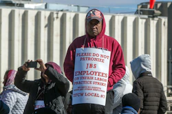 Workers from the JBS Beef Plant protest across the road from the plant on March 16, 2026 in Greeley, Colo.