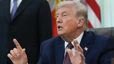 President Donald Trump answers questions from reporters after signing an executive order in the Oval Office of the White House Tuesday, March 31, 2026, in Washington.