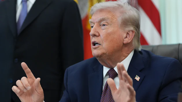 President Donald Trump answers questions from reporters after signing an executive order in the Oval Office of the White House Tuesday, March 31, 2026, in Washington.