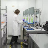 A scientist prepares samples while doing research on PFAS at a U.S. Environmental Protection Agency lab. Understanding of chemicals’ risks has been built on IRIS assessments.