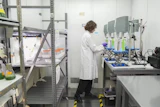 A scientist prepares samples while doing research on PFAS at a U.S. Environmental Protection Agency lab. Understanding of chemicals’ risks has been built on IRIS assessments.