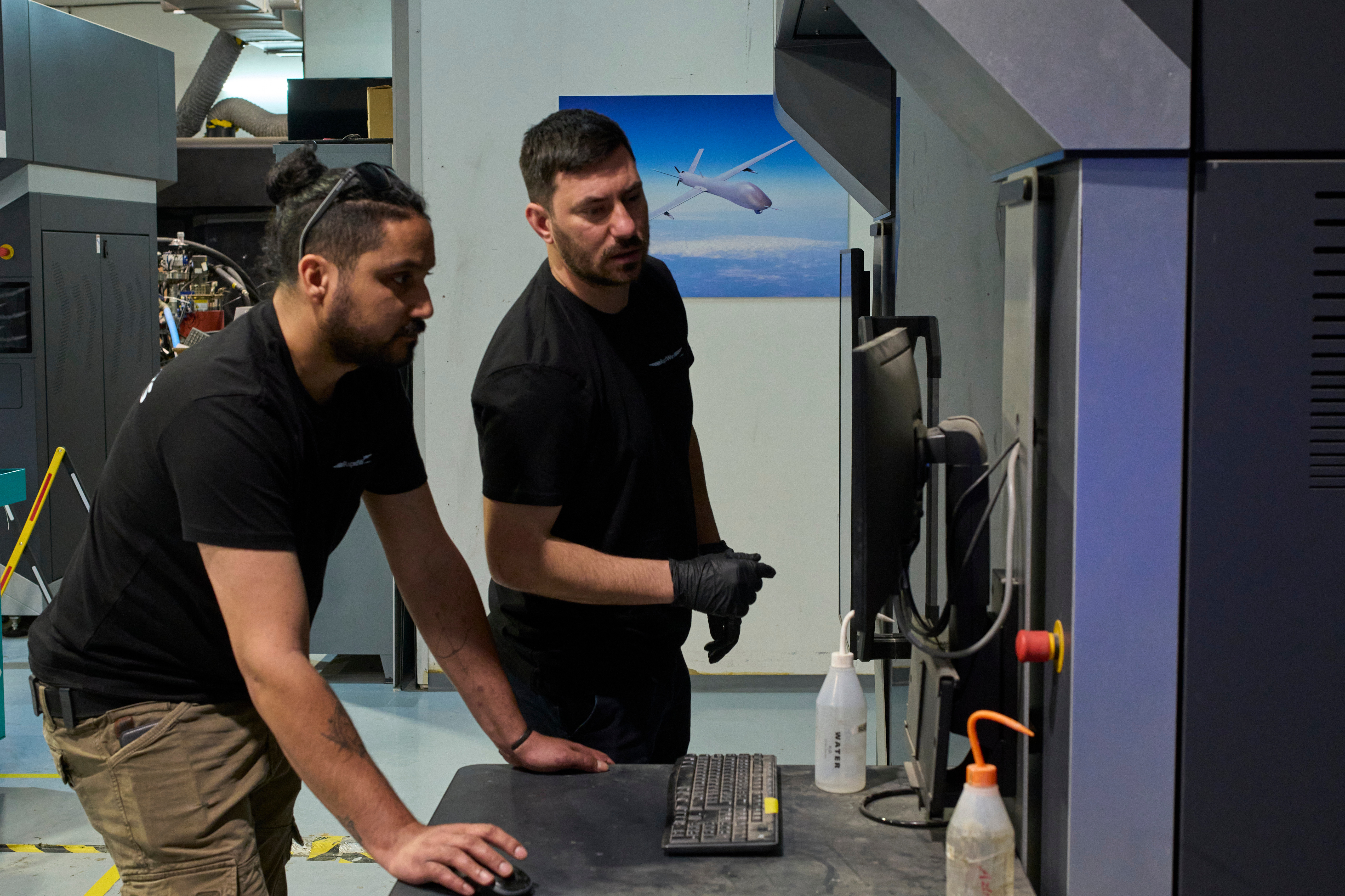 Workers operate a 3D printer that makes drone parts at the headquarters of Masssivit in Lod, Israel, March 30, 2026.