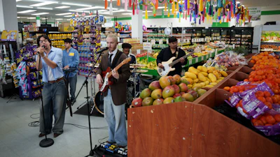 Luna Luna performs in the produce section of Fiesta Fresh Market in New Castle, Del., April 26, 2026.