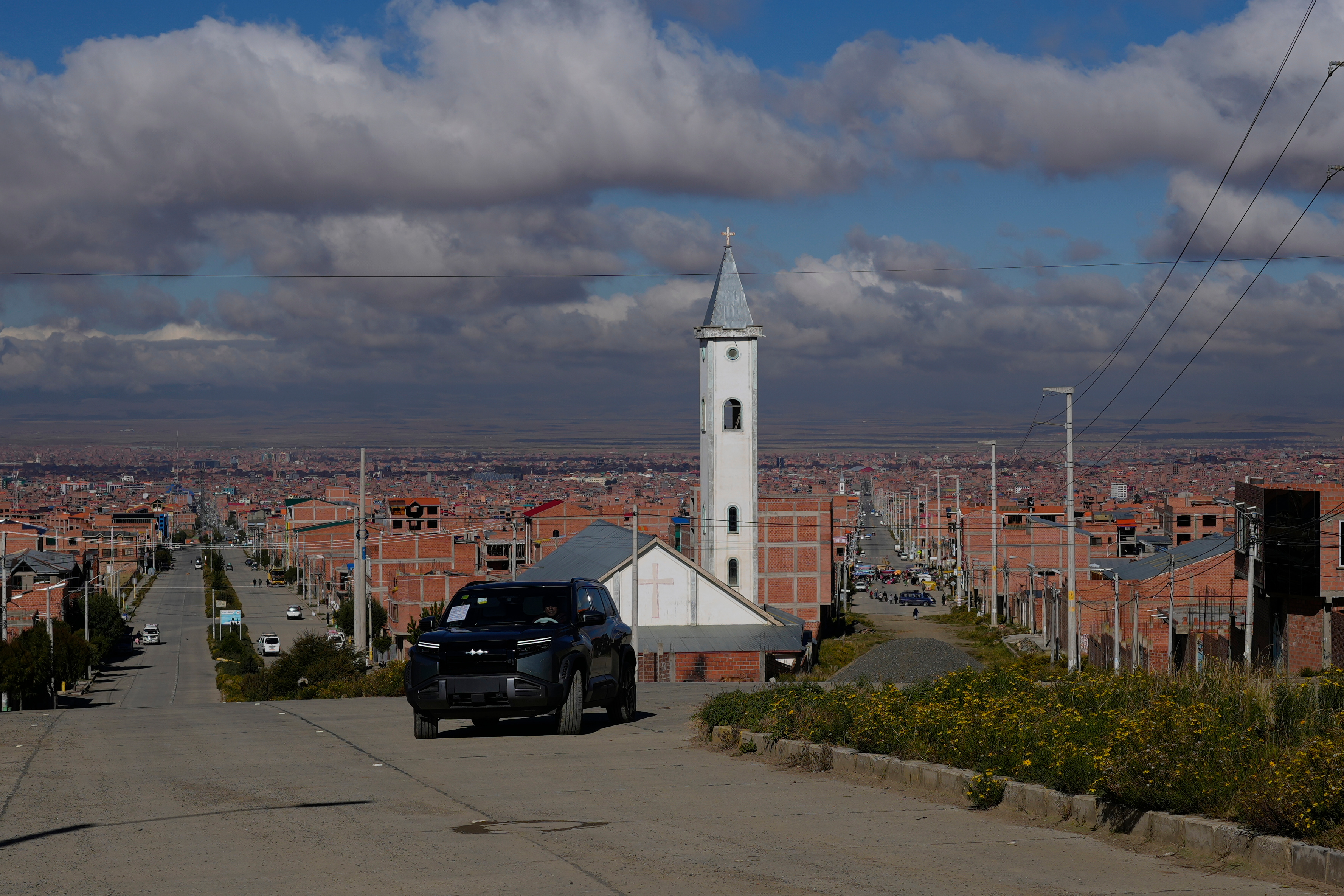 Sim&oacute;n Huanca drives his electric vehicle through the streets of El Alto, Bolivia, Friday, April 24, 2026.