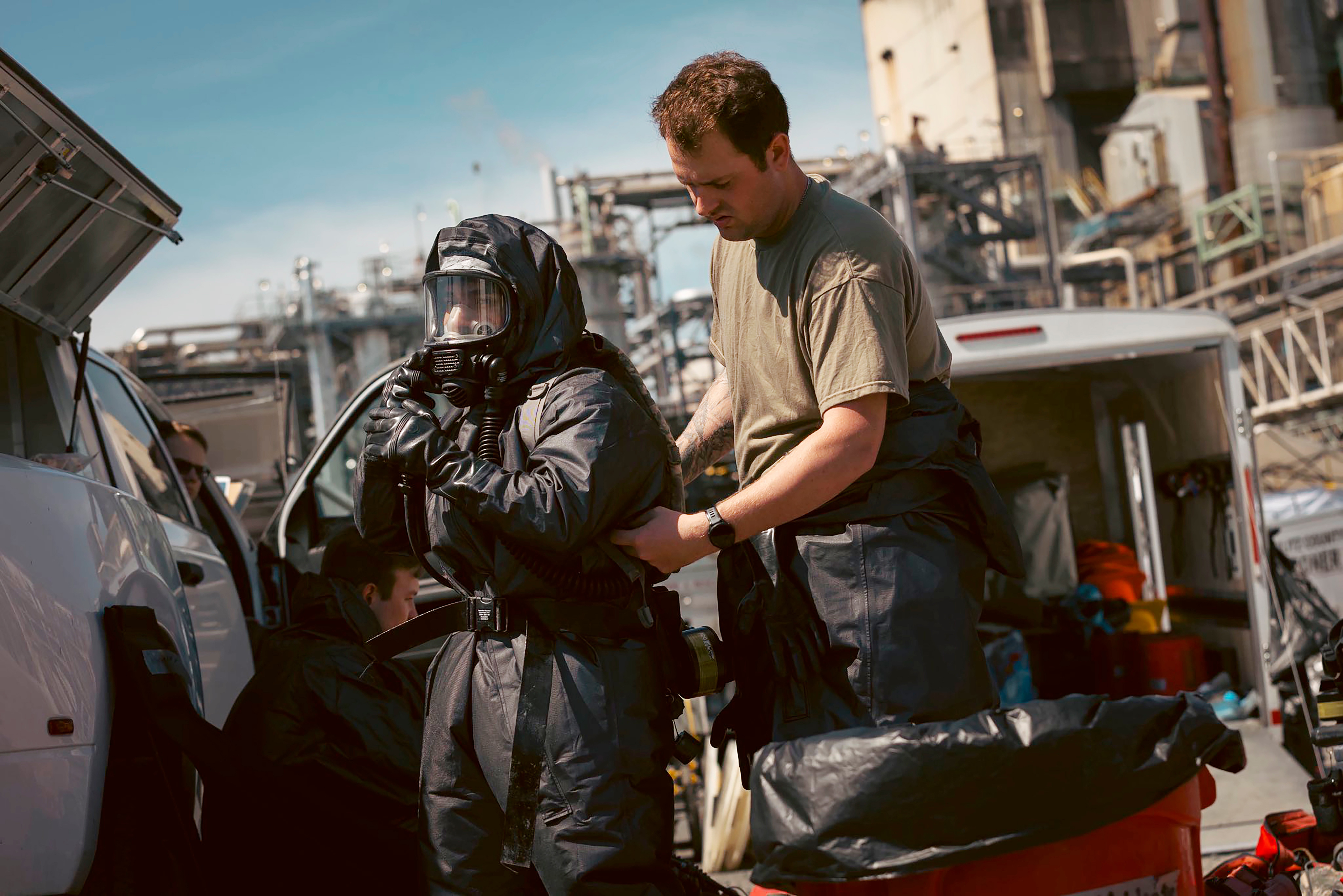 Soldiers and airmen from the Washington National Guard's 10th Homeland Response Force offer support to first responders following an implosion of a chemical tank at Nippon Dynawave pulp and paper mill on Thursday, May 28, 2026, in Longview, Wash.