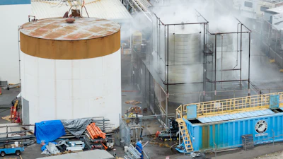 Water is sprayed on a damaged tank at GKN Aerospace in Garden Grove, Calif., on Sunday, May 24, 2026, after the tank containing a chemical used to make plastic parts overheated Thursday.