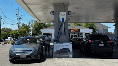 A sign blaming Sacramento policies for high gas prices is displayed at a Chevron gas station in Alameda, Calif., on Thursday, May 21, 2026.