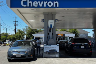 A sign blaming Sacramento policies for high gas prices is displayed at a Chevron gas station in Alameda, Calif., on Thursday, May 21, 2026.