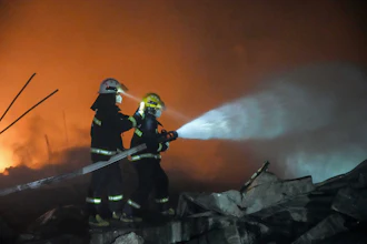 In this photo released by Xinhua News Agency, firefighters work to out the fire after an explosion at a fireworks plant in Guandu Town of Liuyang, central China's Hunan Province, in the early hours of May 5, 2026.