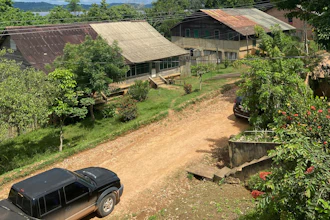 This photo provided by the Brazilian Federal Justice shows a truck driving past buildings in Fordlandia, Para, Brazil, Dec. 6, 2021.
