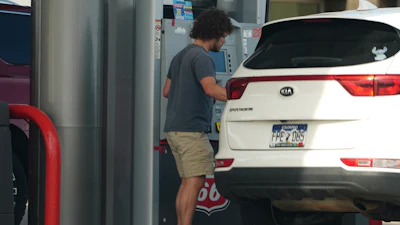 A motorist fills up the tank of a utility vehicle at a Phillips 66 gasoline station at Denver International Airport Saturday, May 9, 2026, in Denver.
