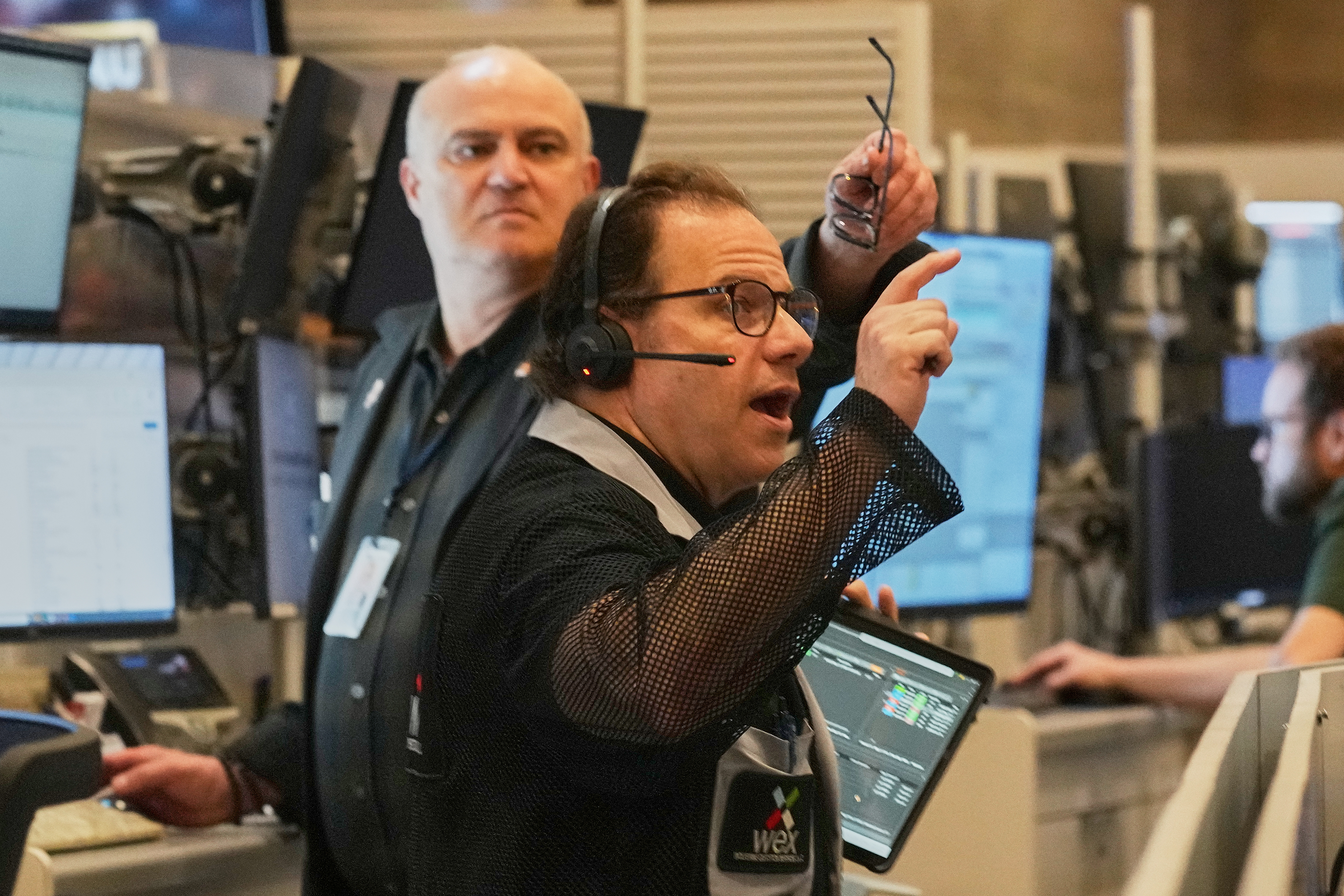 Options trader Anthony Spina, foreground, works on the floor of the New York Stock Exchange, Thursday, April 30, 2026.