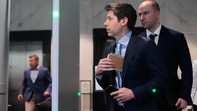Sam Altman, center, and OpenAI president Greg Brockman, right, arrive at the U.S. District Court in Oakland, Calif., Thursday, April 30, 2026.