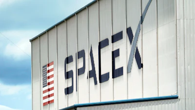 A SpaceX logo is displayed on a building, May 26, 2020, at the Kennedy Space Center in Cape Canaveral, Fla.